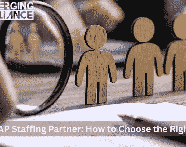 Magnifying glass highlighting a wooden figure among others — representing the process of choosing the best SAP staffing partner.